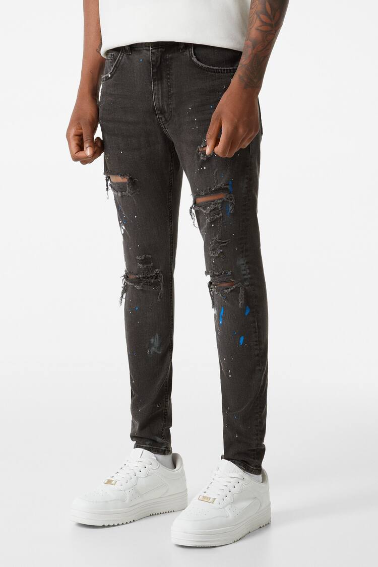 Ripped paint splatter skinny jeans
