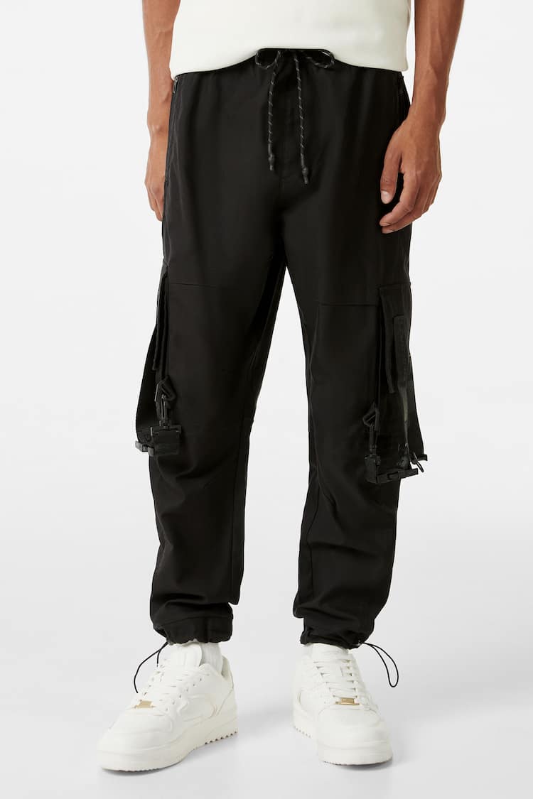 Cotton trousers with straps and pockets