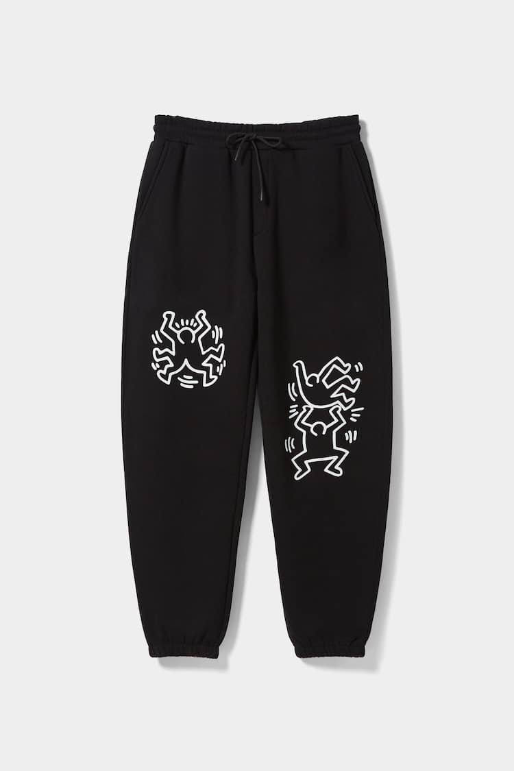 Jogger-housut Keith Haring -printillä
