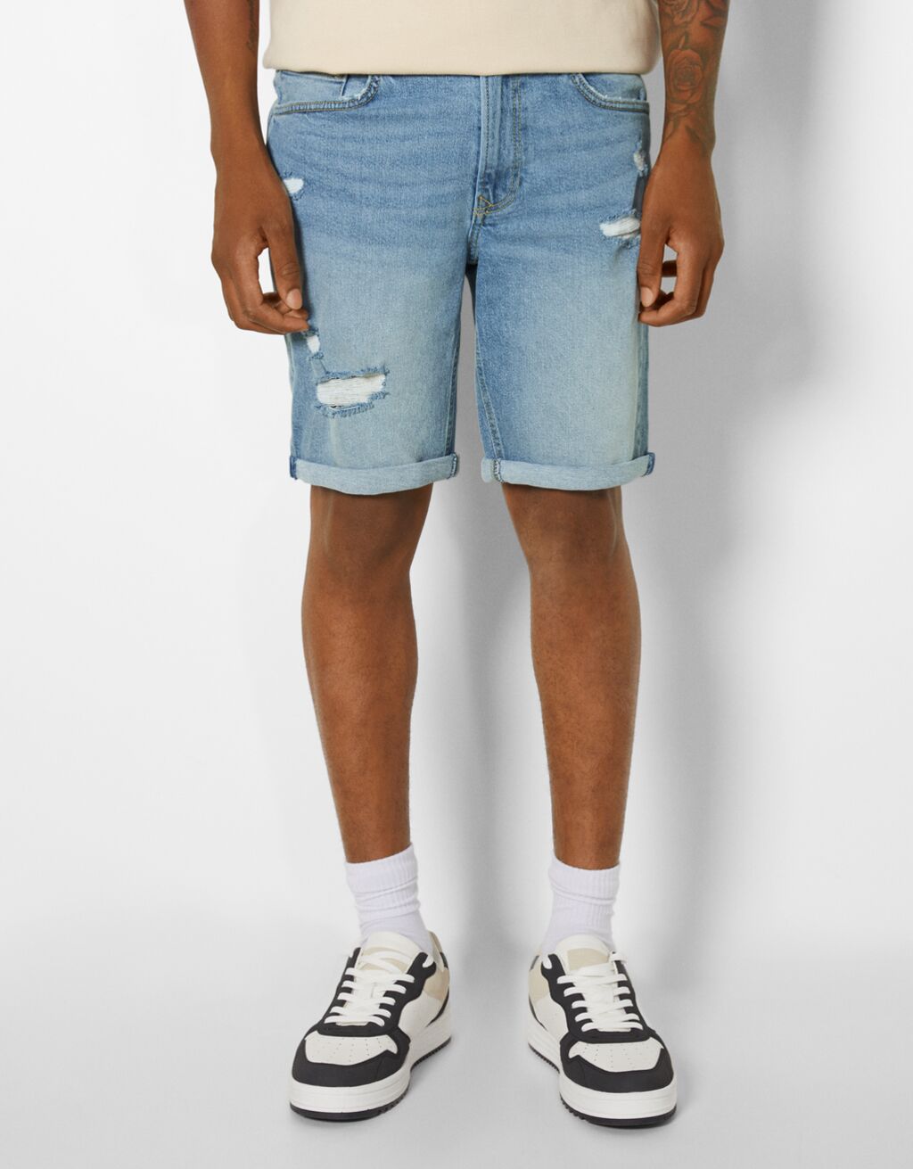 Ripped slim fit denim bermuda shorts Man Bershka