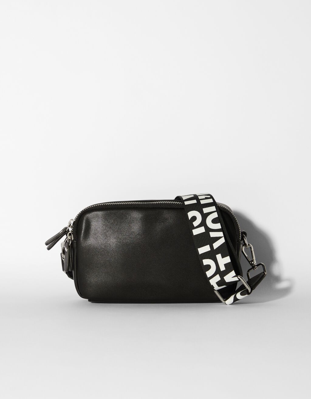 Crossbody bag with lettering strap
