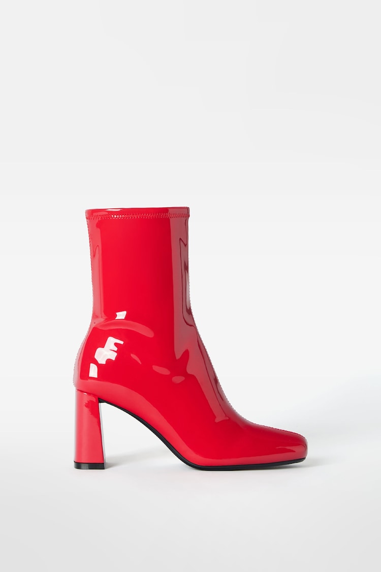 High-heel patent-style fitted ankle boots