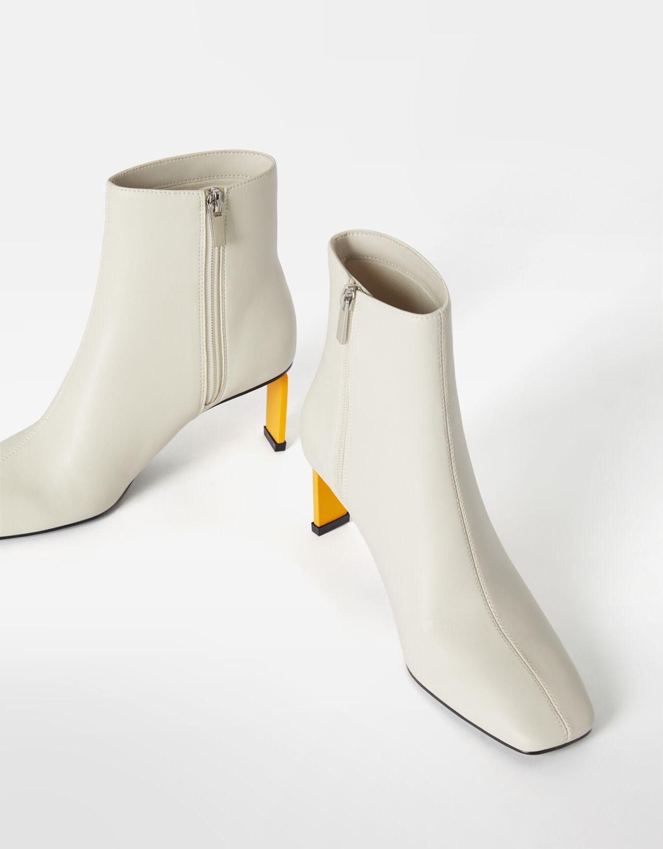 Colourful heeled ankle boots, £59.99, Bershka