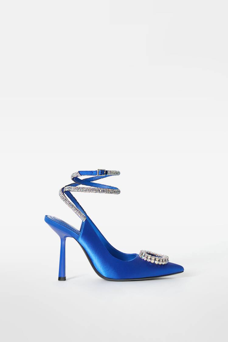 Rhinestone-encrusted heeled slingback shoes