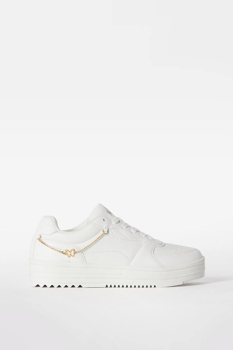 Trainers with beaded strap