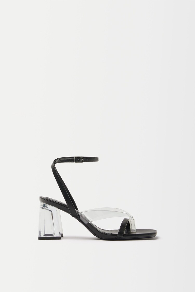 High-heeled contrast vinyl sandals with methacrylate heels.