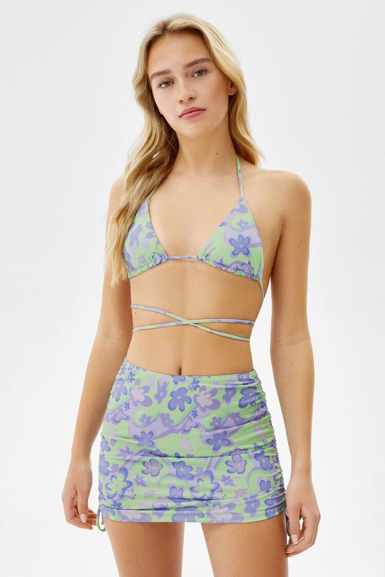 Bikini and sarong set with a psychedelic print
