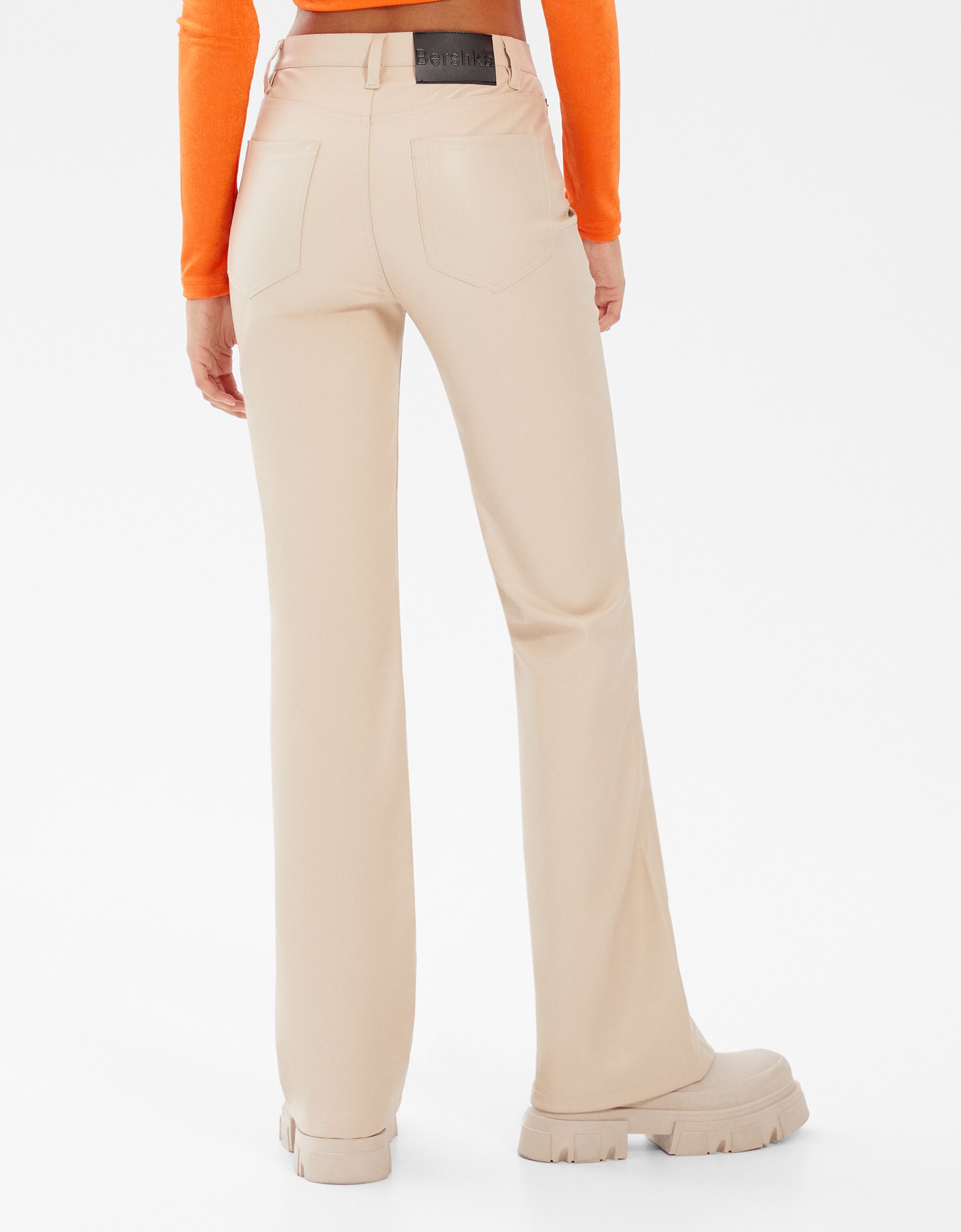 Faux leather flare trousers - BERSHKA 