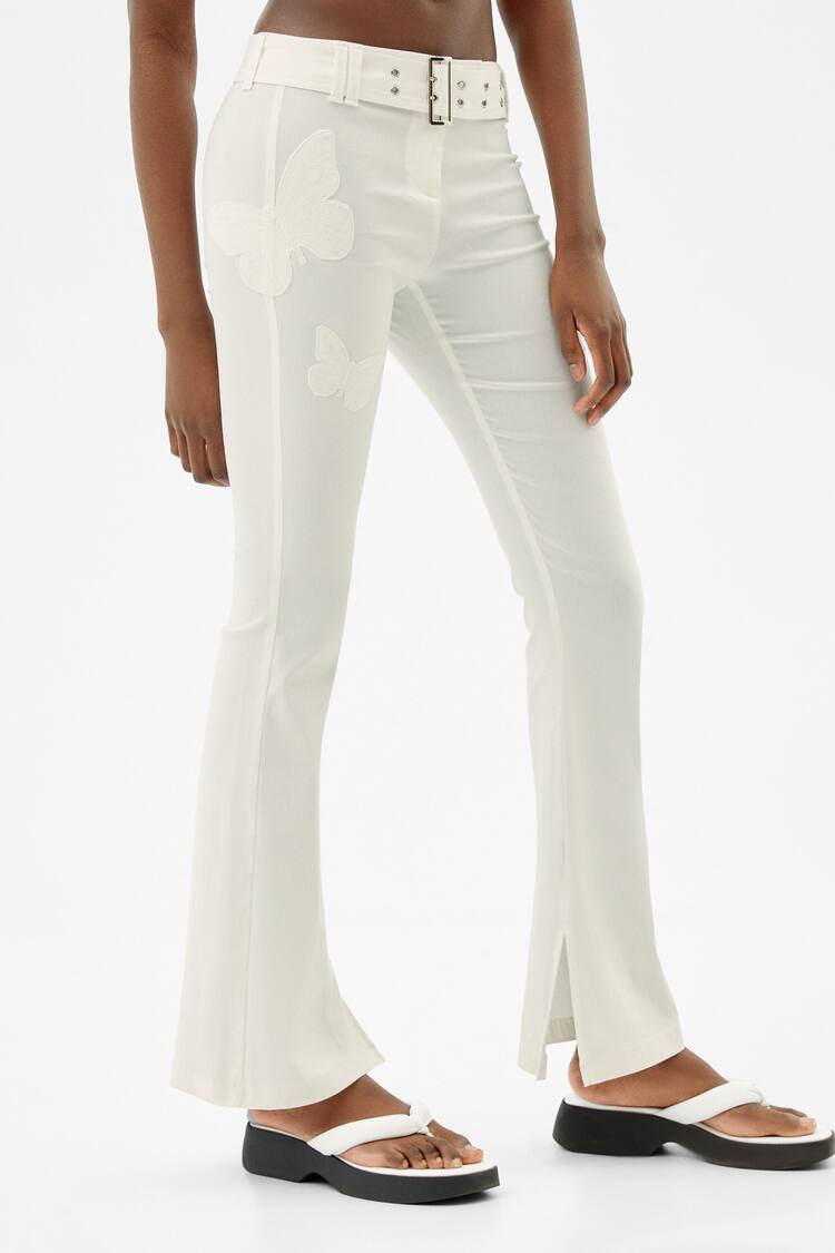 Flared bengaline trousers with butterfly details