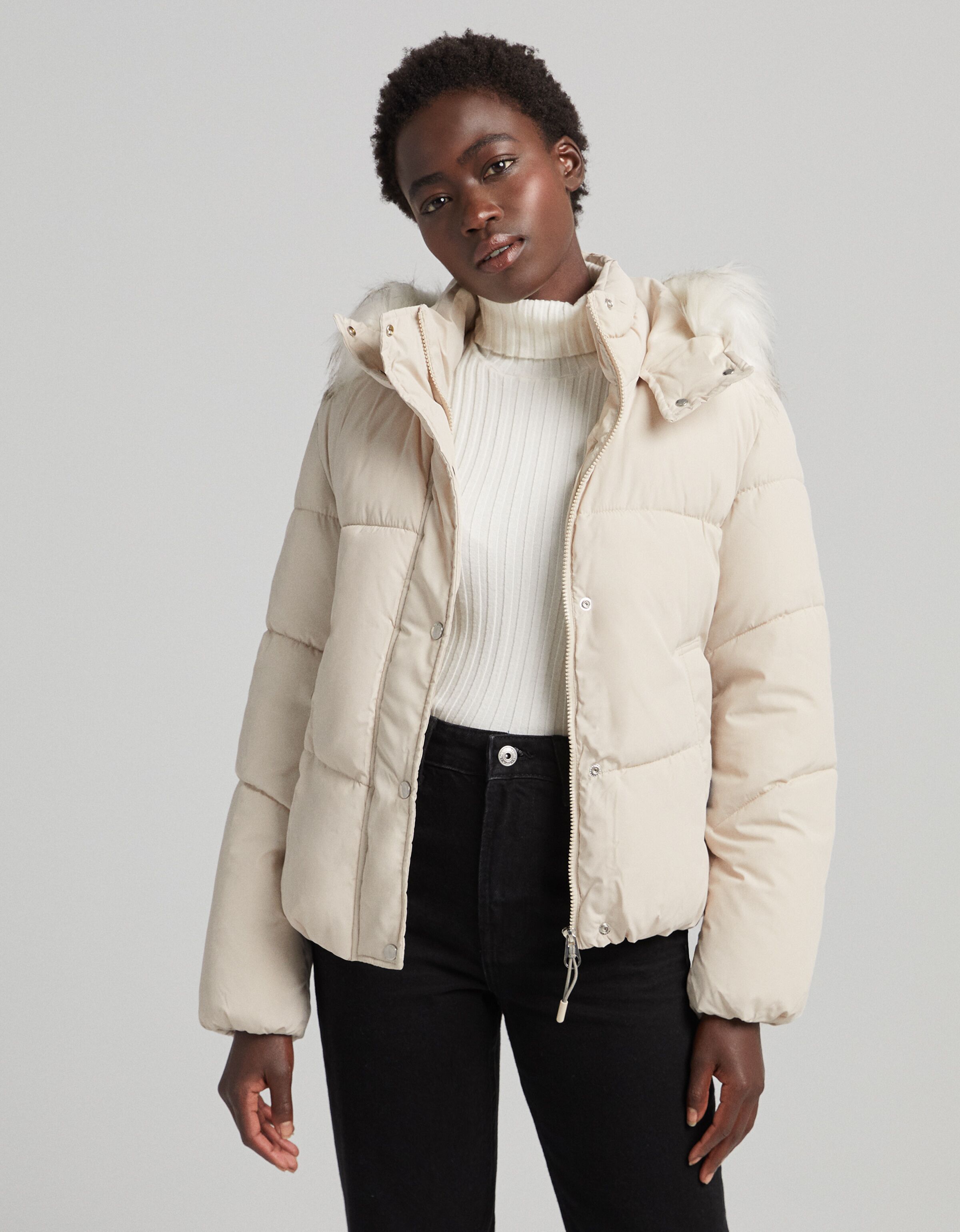 Nylon puffer jacket with faux fur hood 