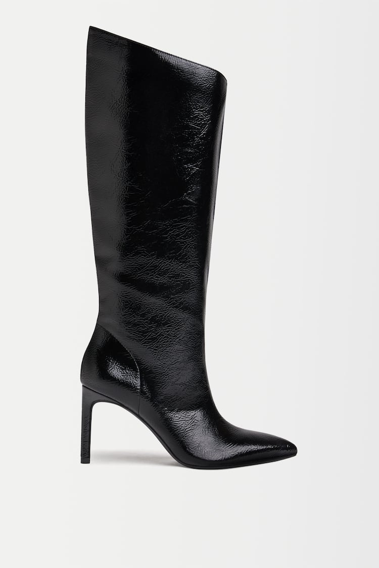 Asymmetric boots with stiletto heels