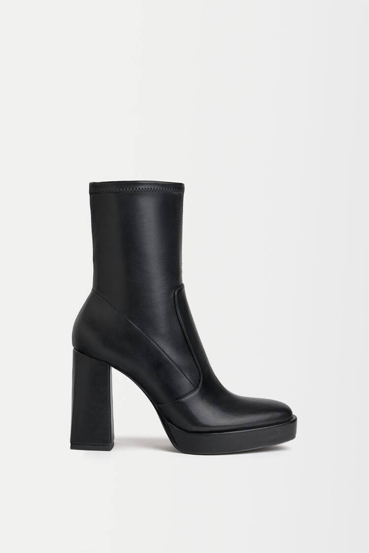 Fitted high-heel platform ankle boots.