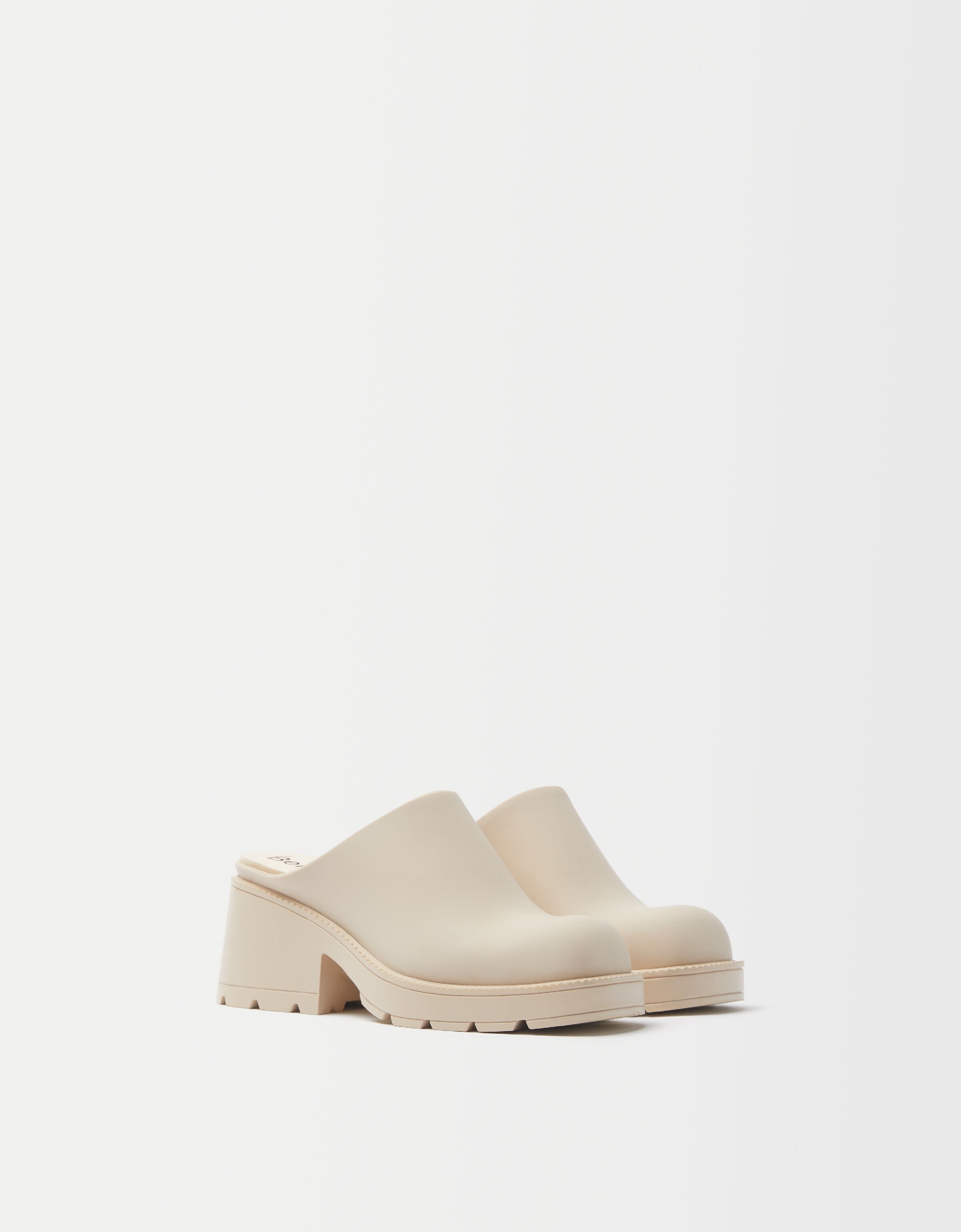 white slip on clogs