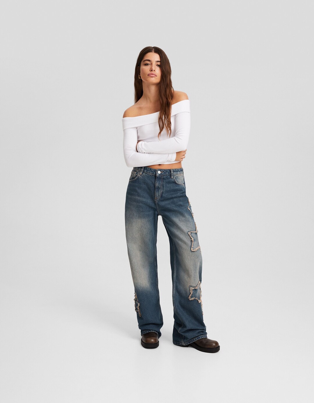 Baggy jeans with patches and star details