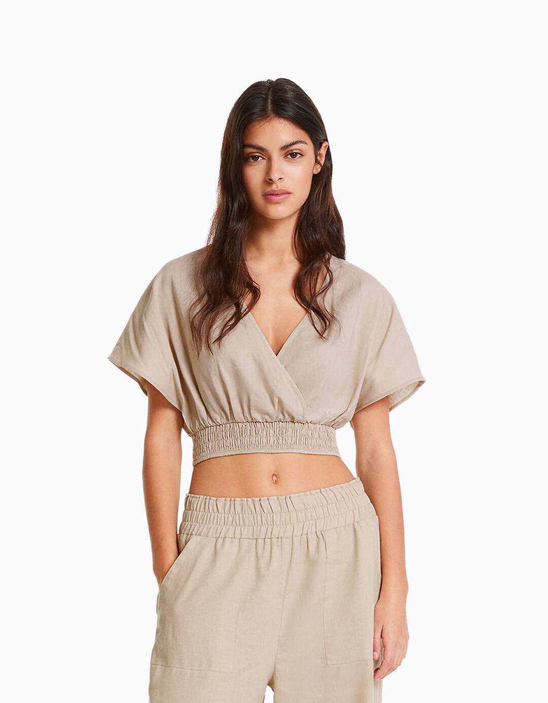 Short sleeve linen blend cropped blouse with crossover neckline