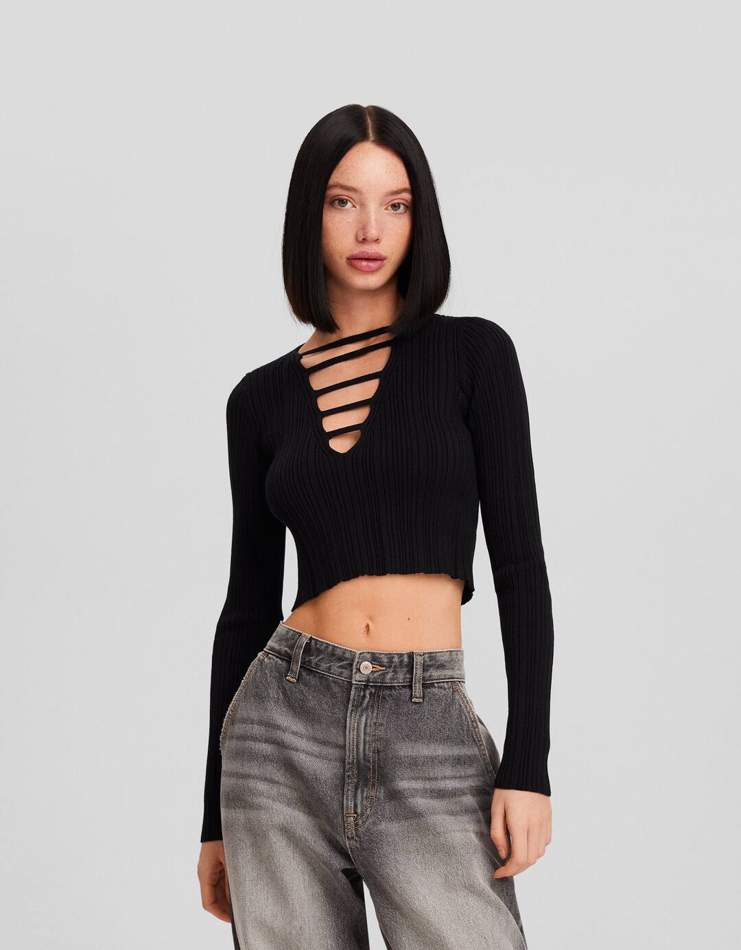 Ribbed knit sweater with plunging neckline and straps