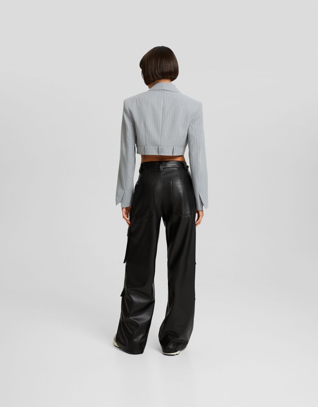 Leather effect multipocket cargo trousers Women Bershka