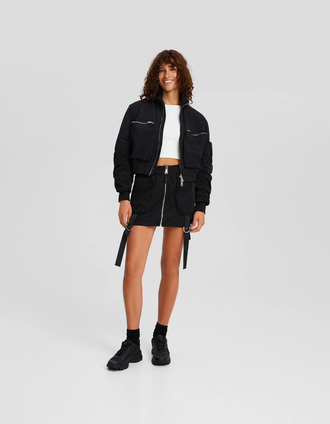 Strappy technical mini skirt with zip