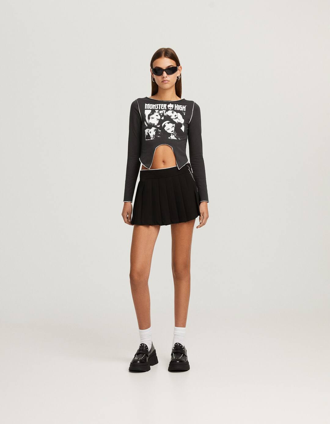Box pleat mini skirt with chain