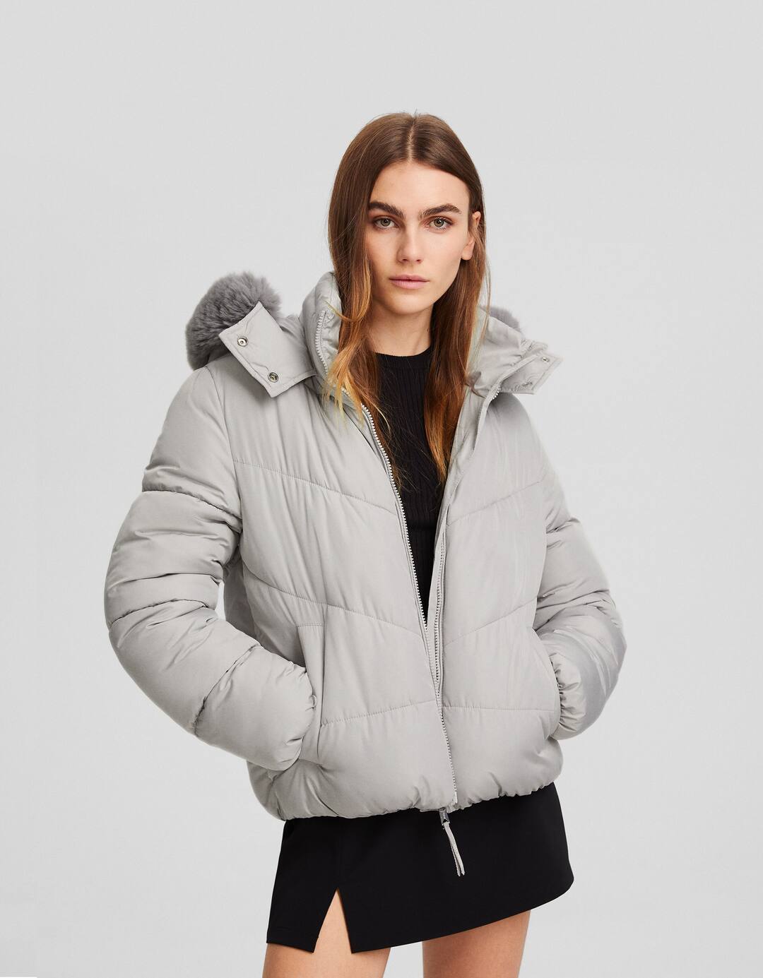 Puffer jacket with faux fur hood