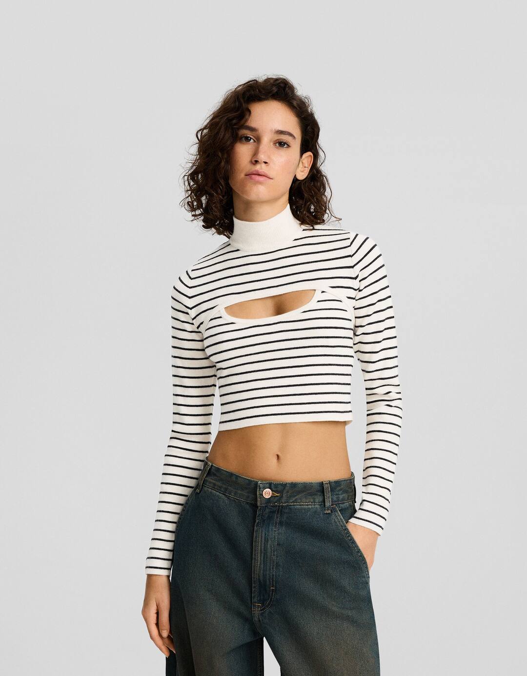 Striped cropped arm warmer sweater with a high neck