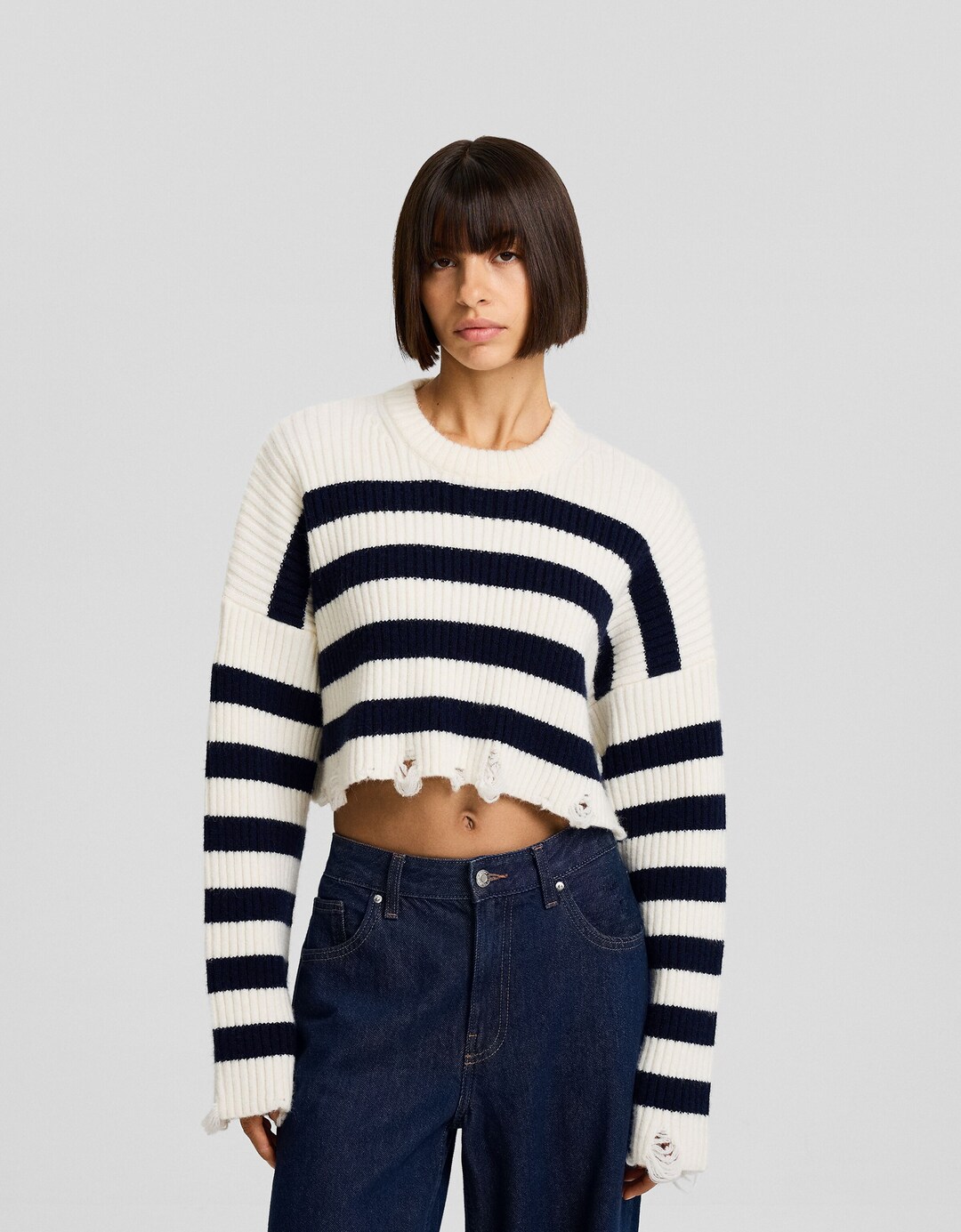 Striped sweater with rips
