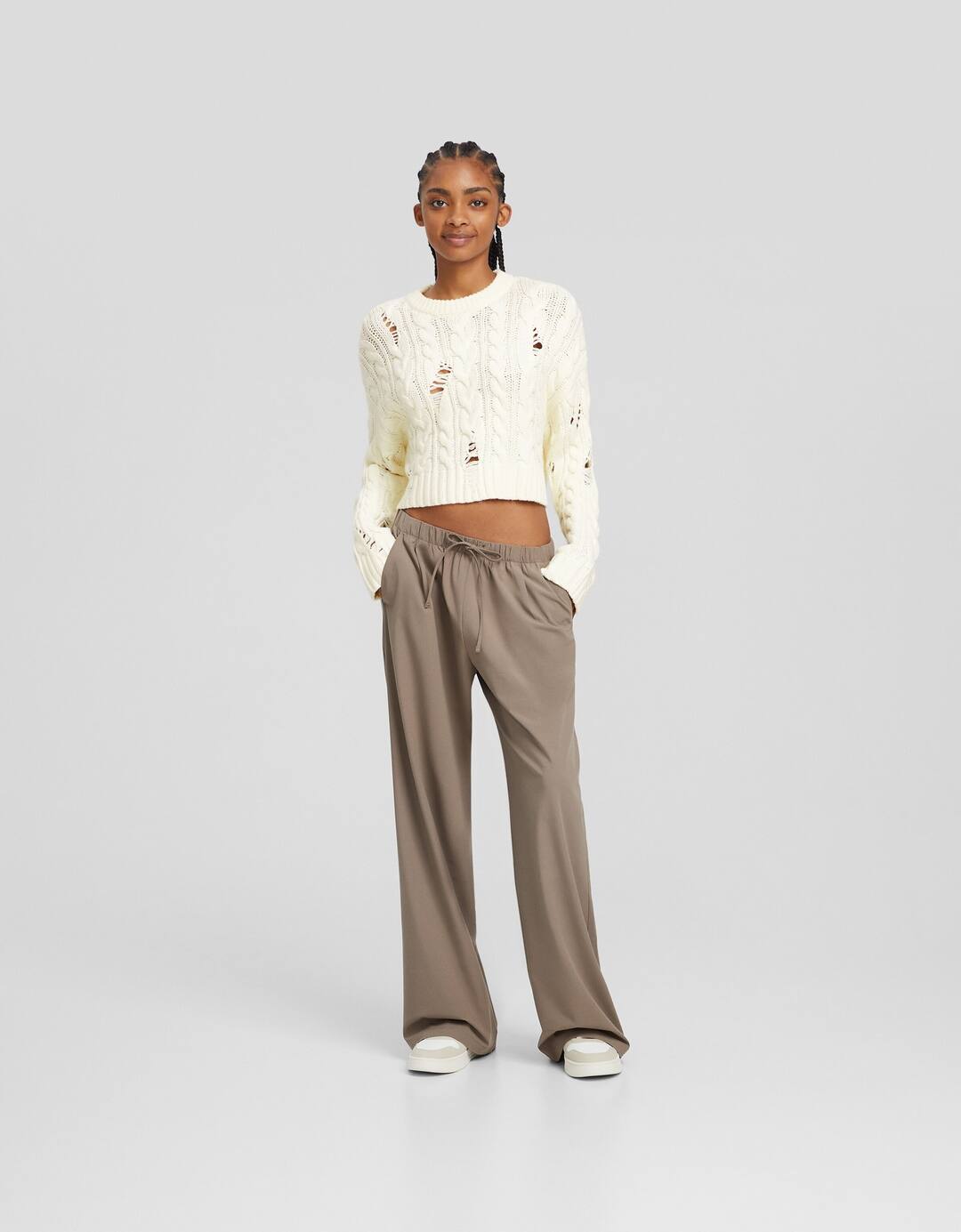 Ripped cable-knit sweater
