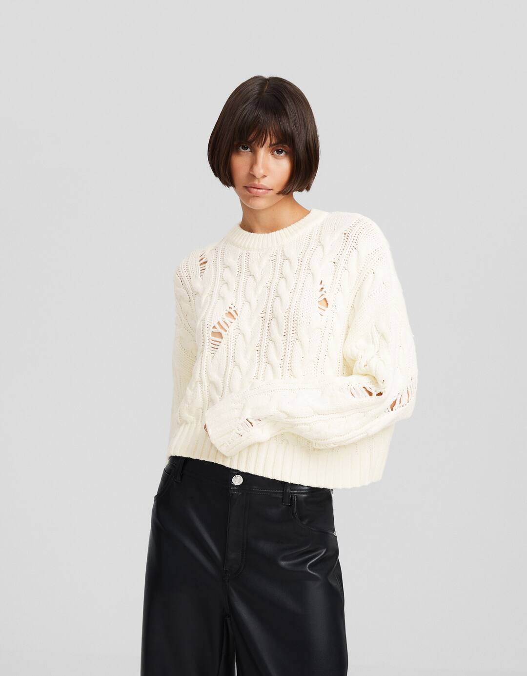 Ripped cable-knit sweater