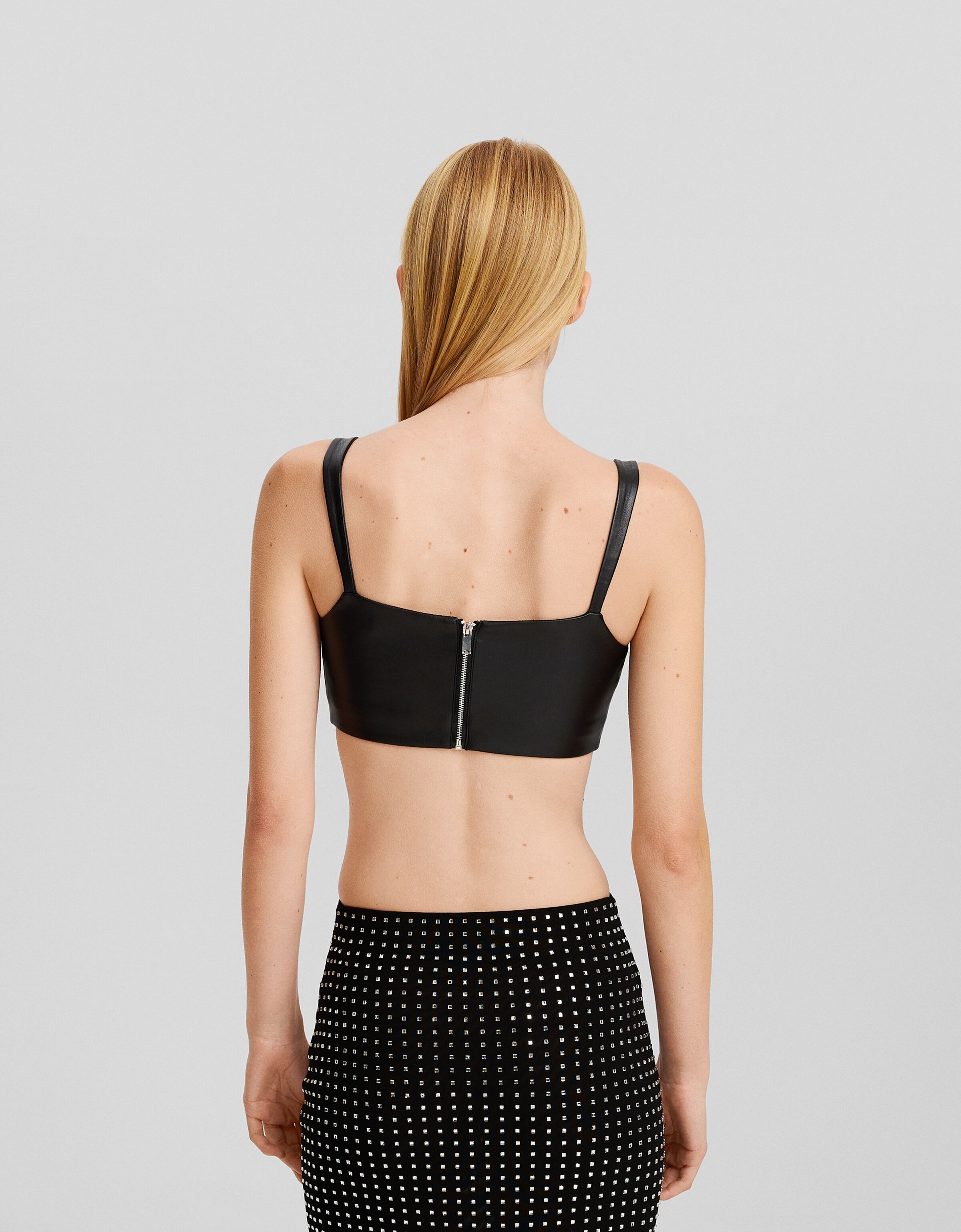 Cropped leather effect strappy top with back zip Women Bershka