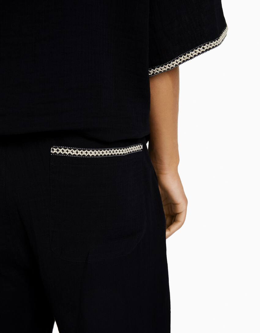 Rustic trousers with embroidered detail-Black-3