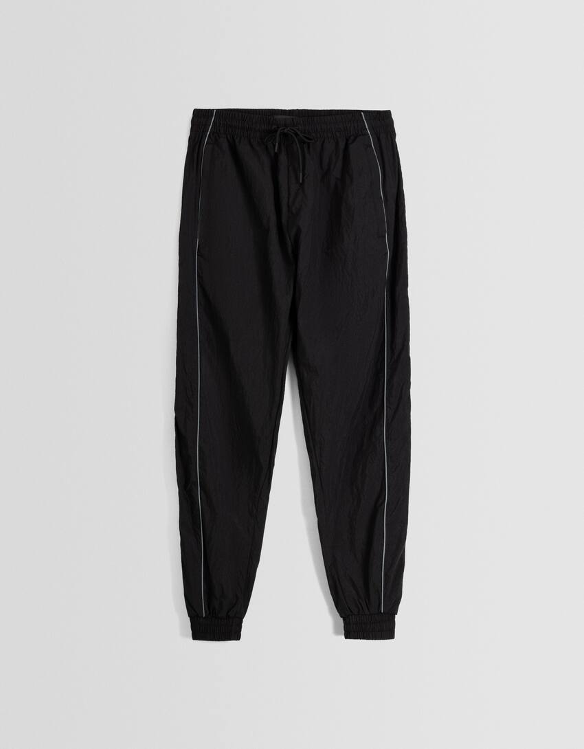 Technical jogging trousers with reflective detail-Black-4