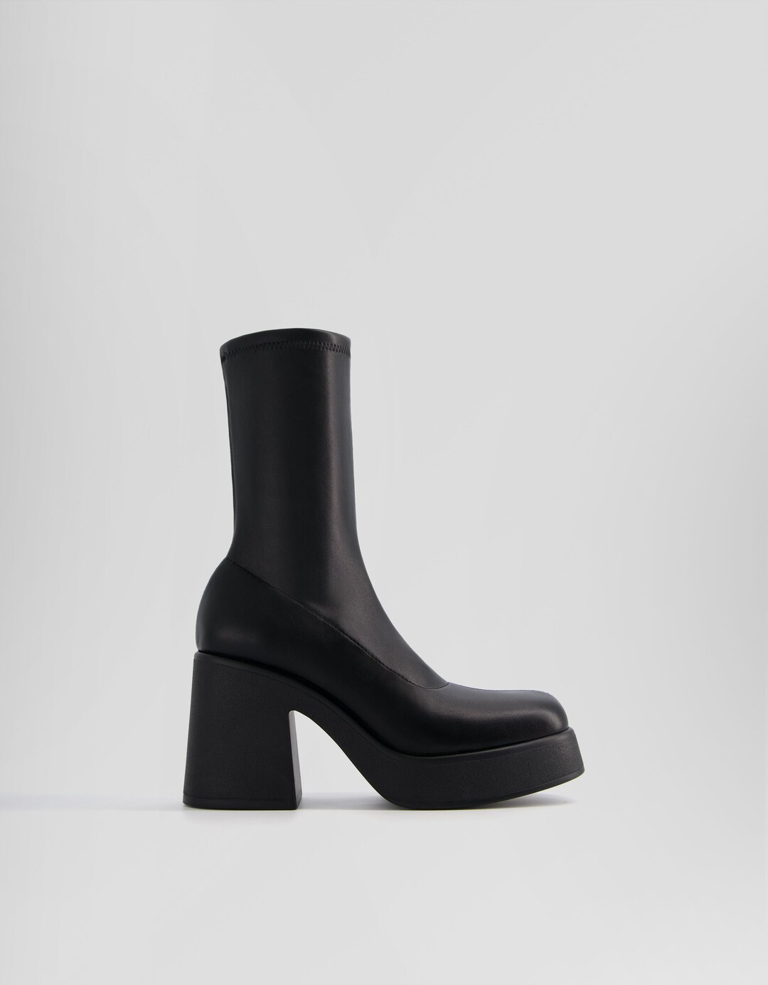 Fitted high-heel platform ankle boots.