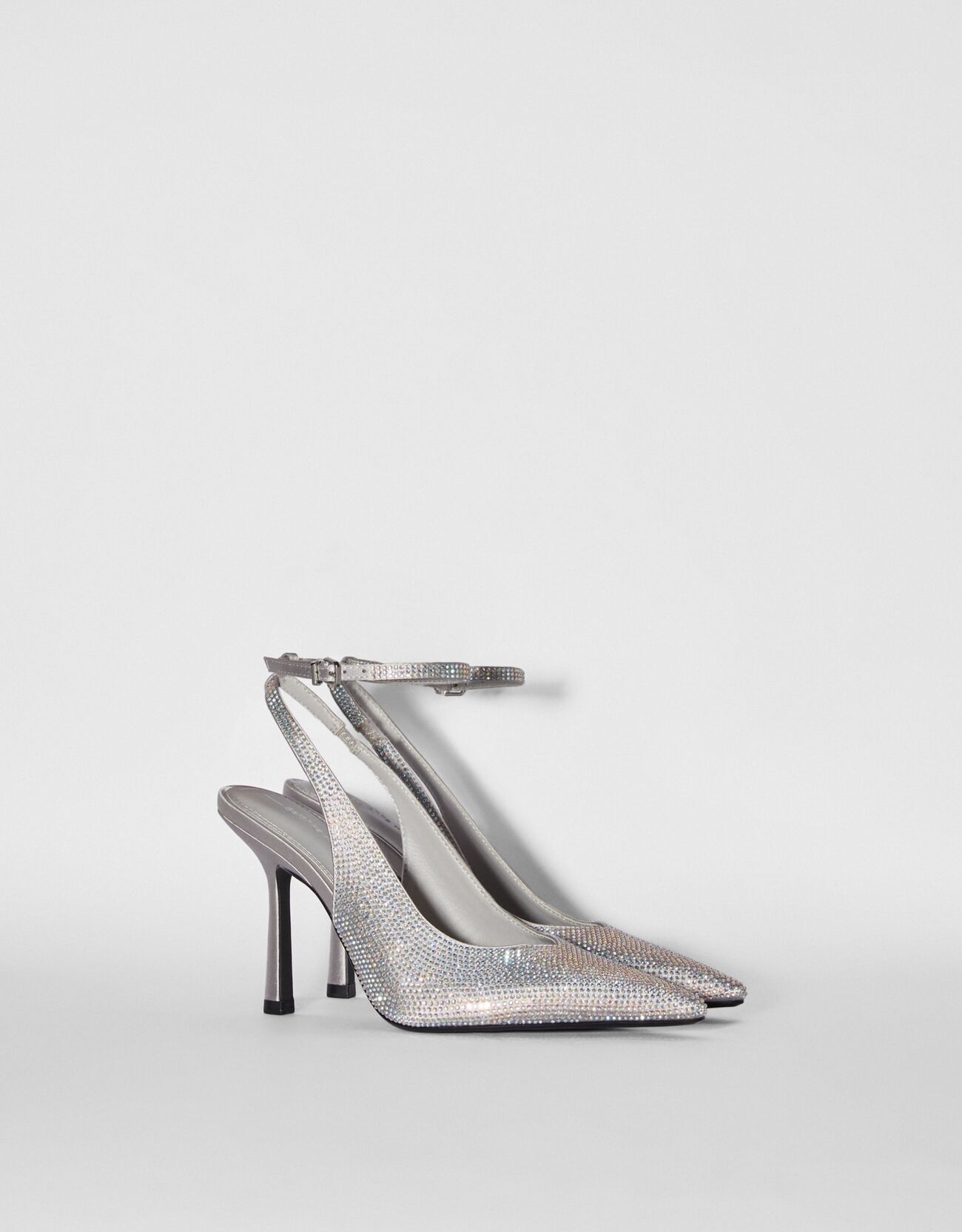 Rhinestone encrusted heeled slingback shoes
