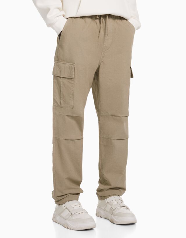 Falsedad Calibre Melódico Cargo trousers with stoppers - New - Man | Bershka