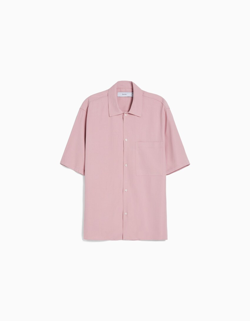 pink shirt with black pants