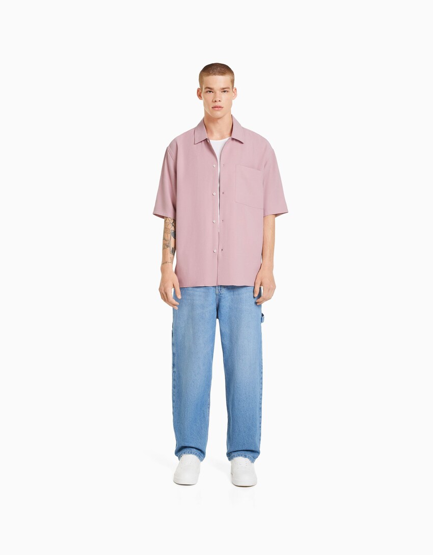 pink shirt with black pants