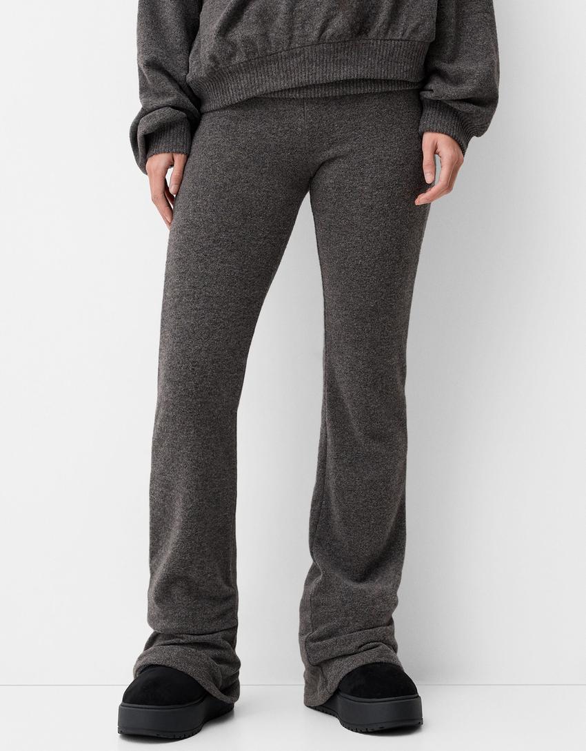 Flared trousers with fold-over waist