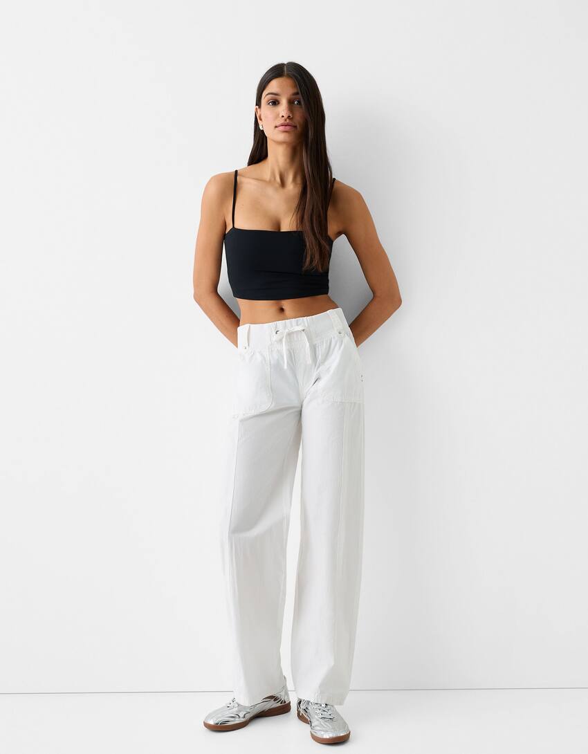Low-waist cotton cargo trousers with strap
