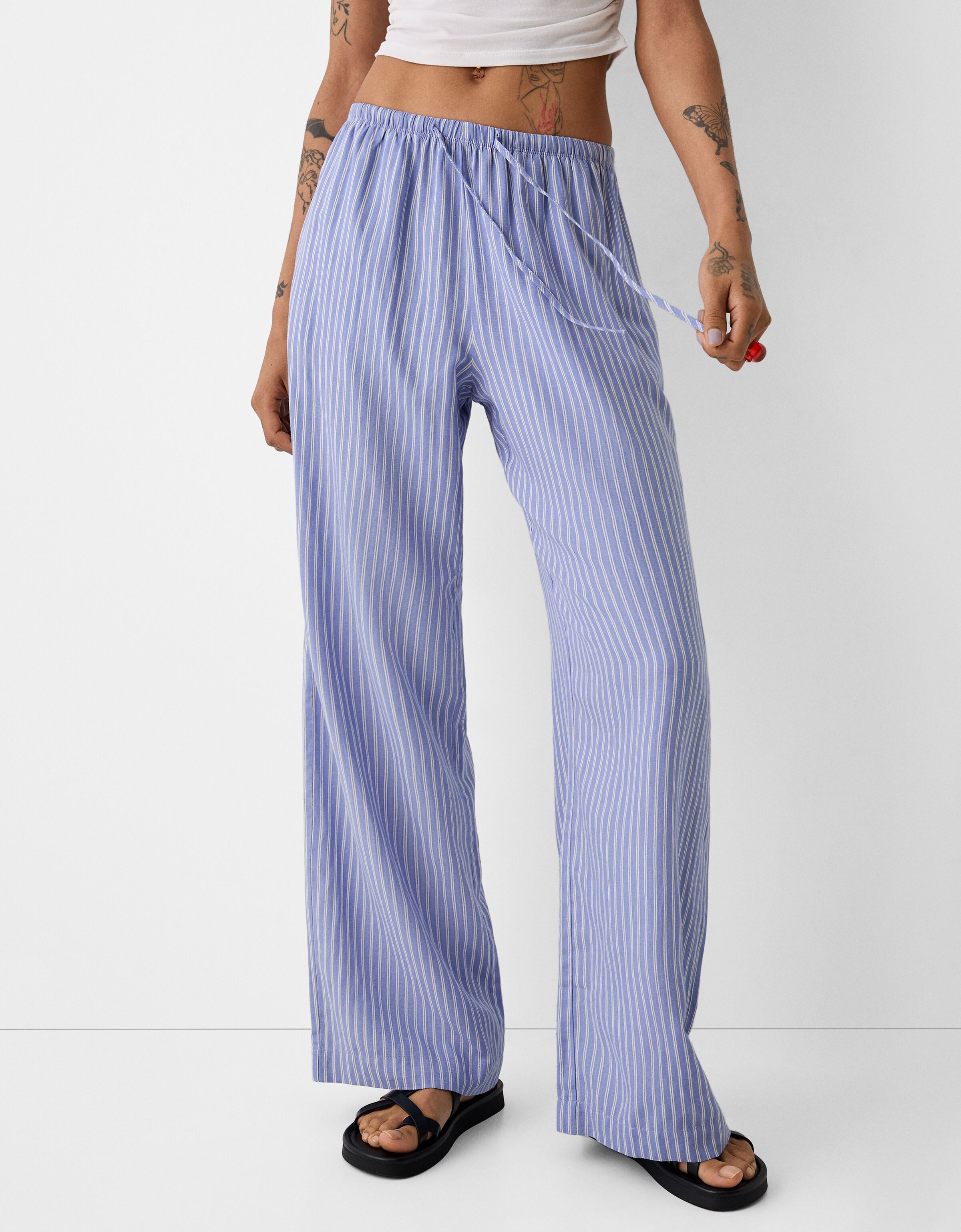 Straight leg striped trousers with elasticated waist Women Bershka