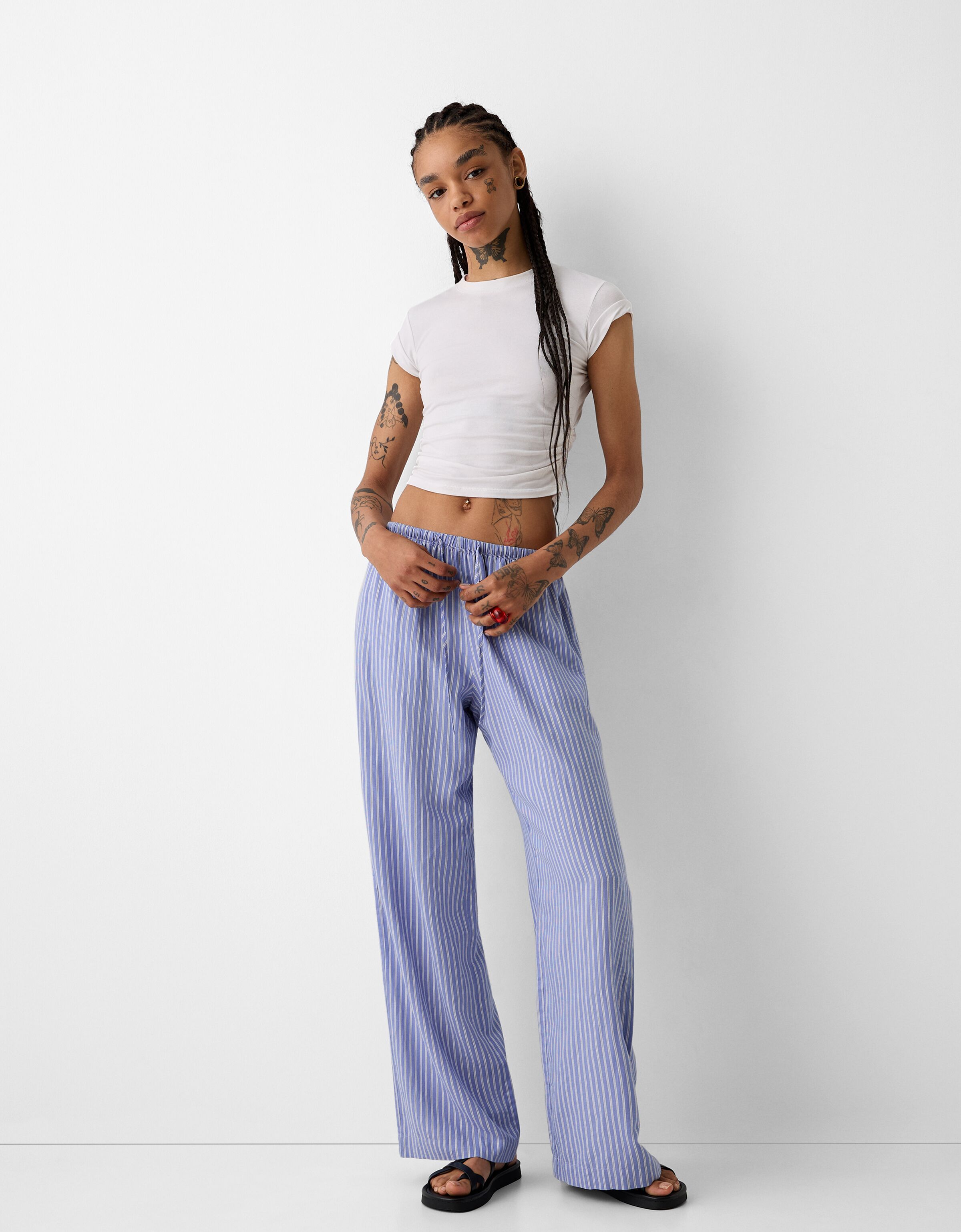 Straight leg striped trousers with elasticated waist Women Bershka