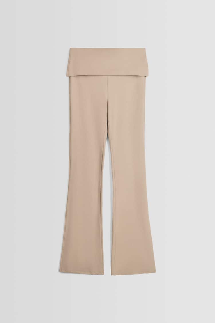 Flared trousers with turn-up waist