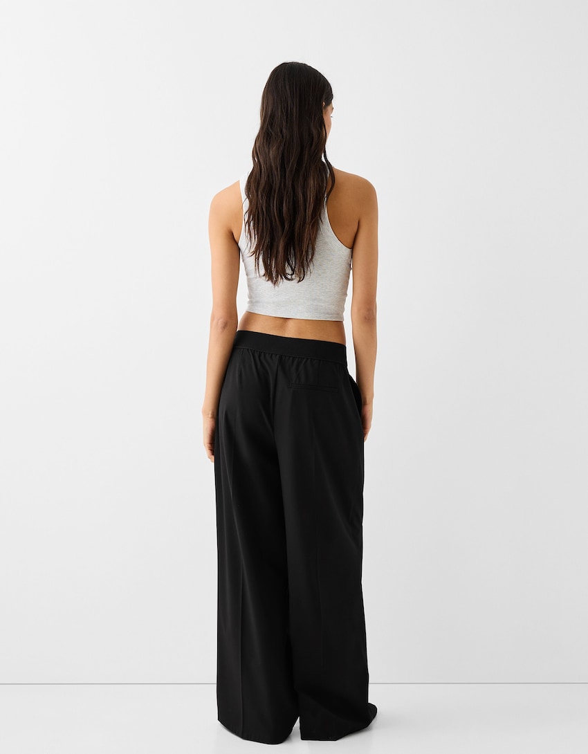 Wide-leg tailored fit trousers with elastic waist - Women | Bershka