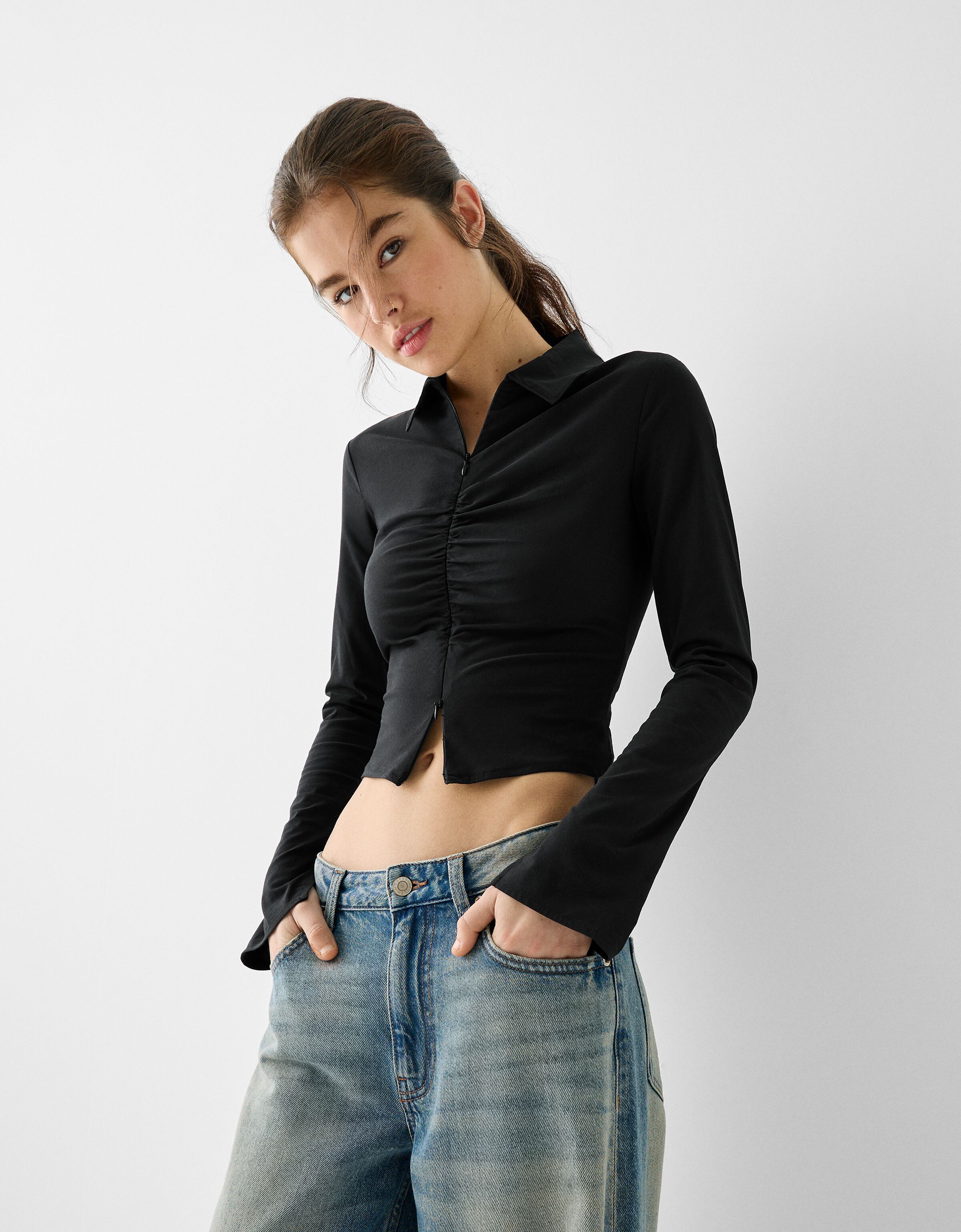 Blusa negra transparente online bershka