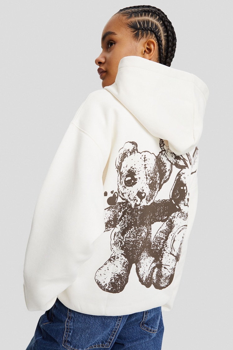 Oversized capuchonsweater met rits en print