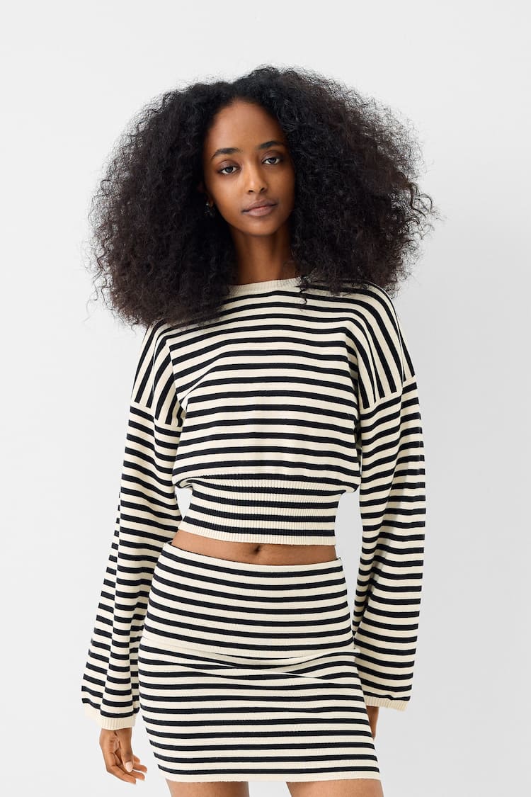 Sweater with fitted waist