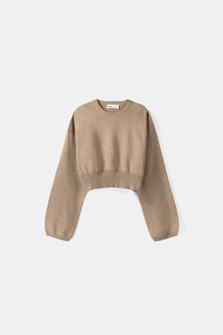 Sweater with fitted waist