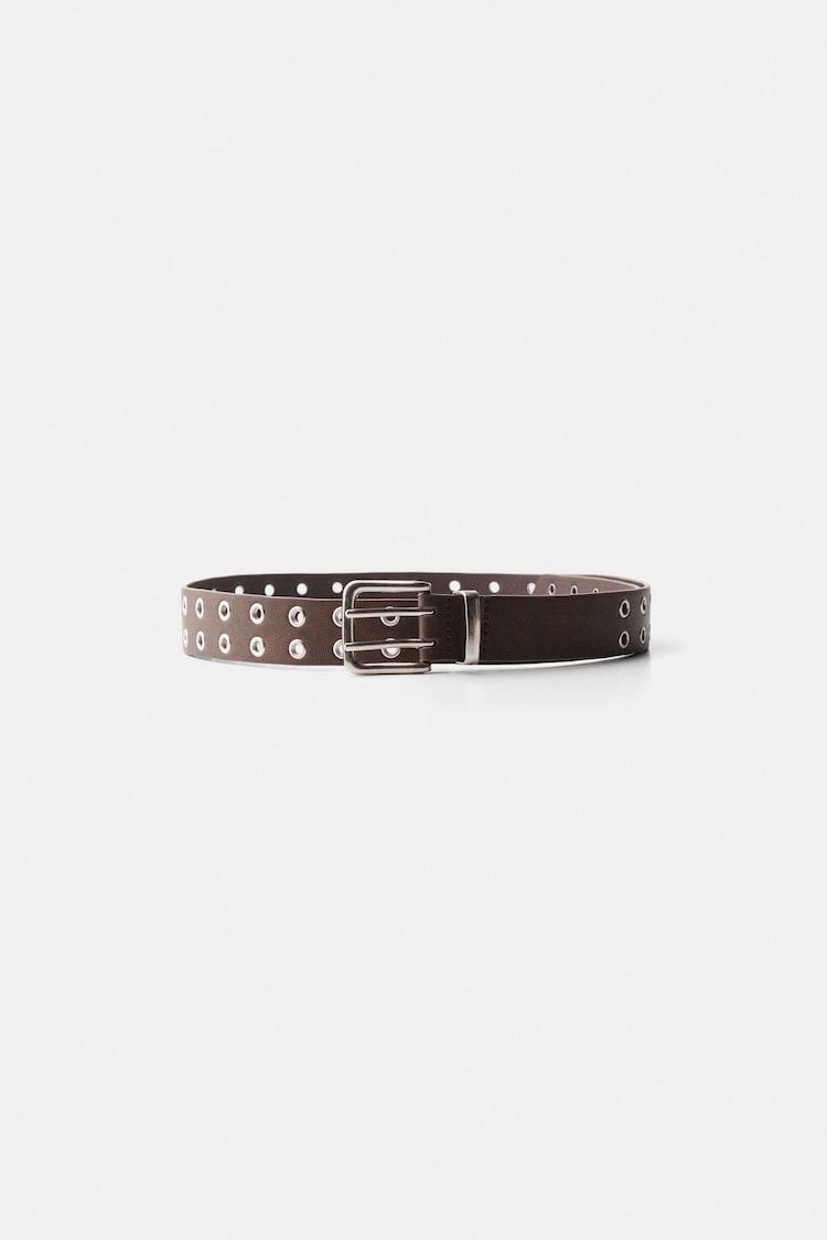 Distressed belt with eyelets