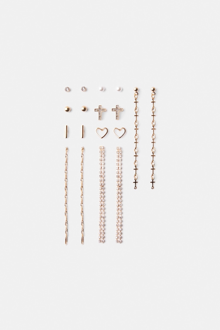 Set van 9 paar oorbellen met ingelegd strass en kruis