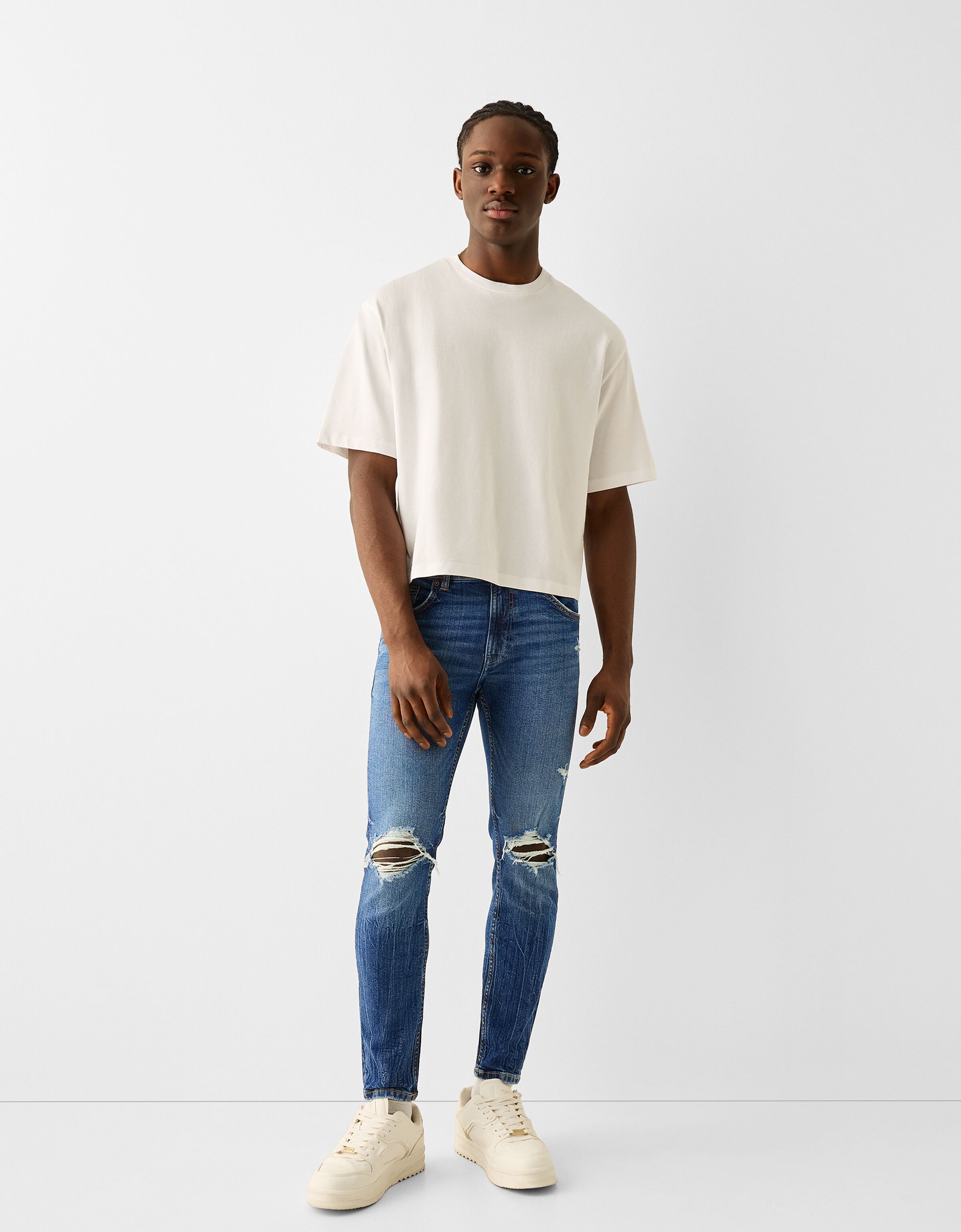 White cut up jeans hot sale mens