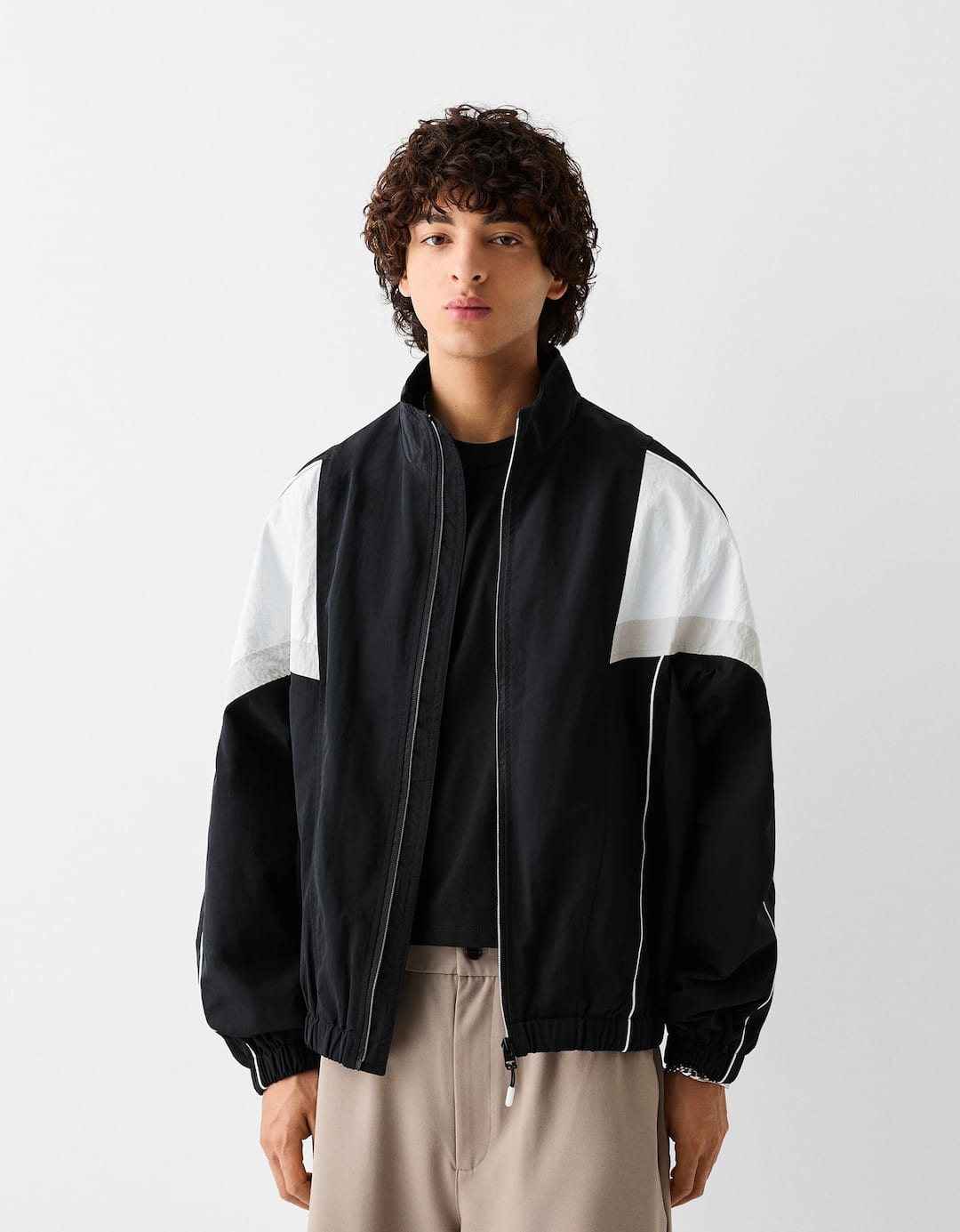 Technical jacket with seams